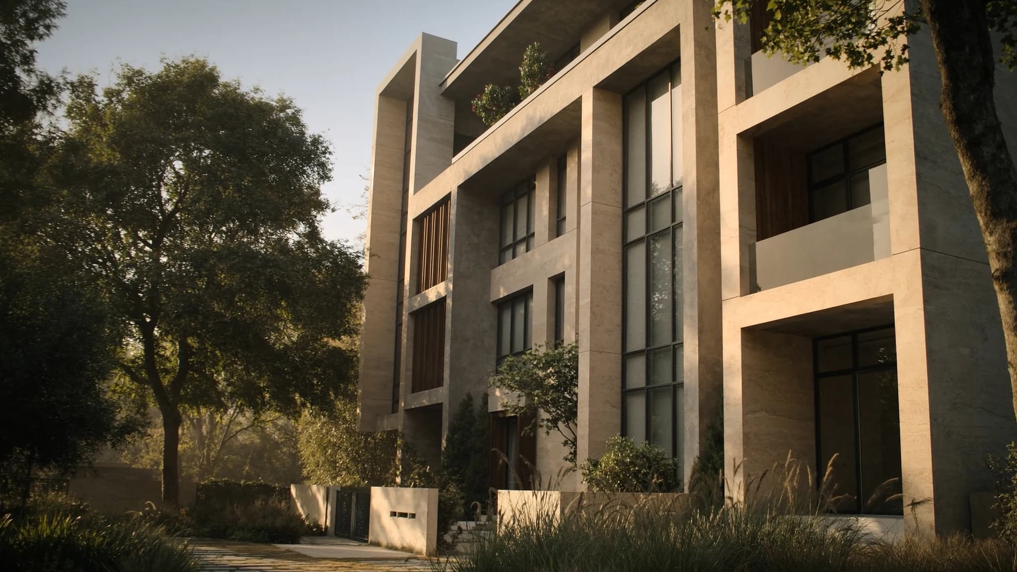 Close study of the signature façade: tall limestone fins, deeply recessed windows and vertical timber louvres in low morning sun.
